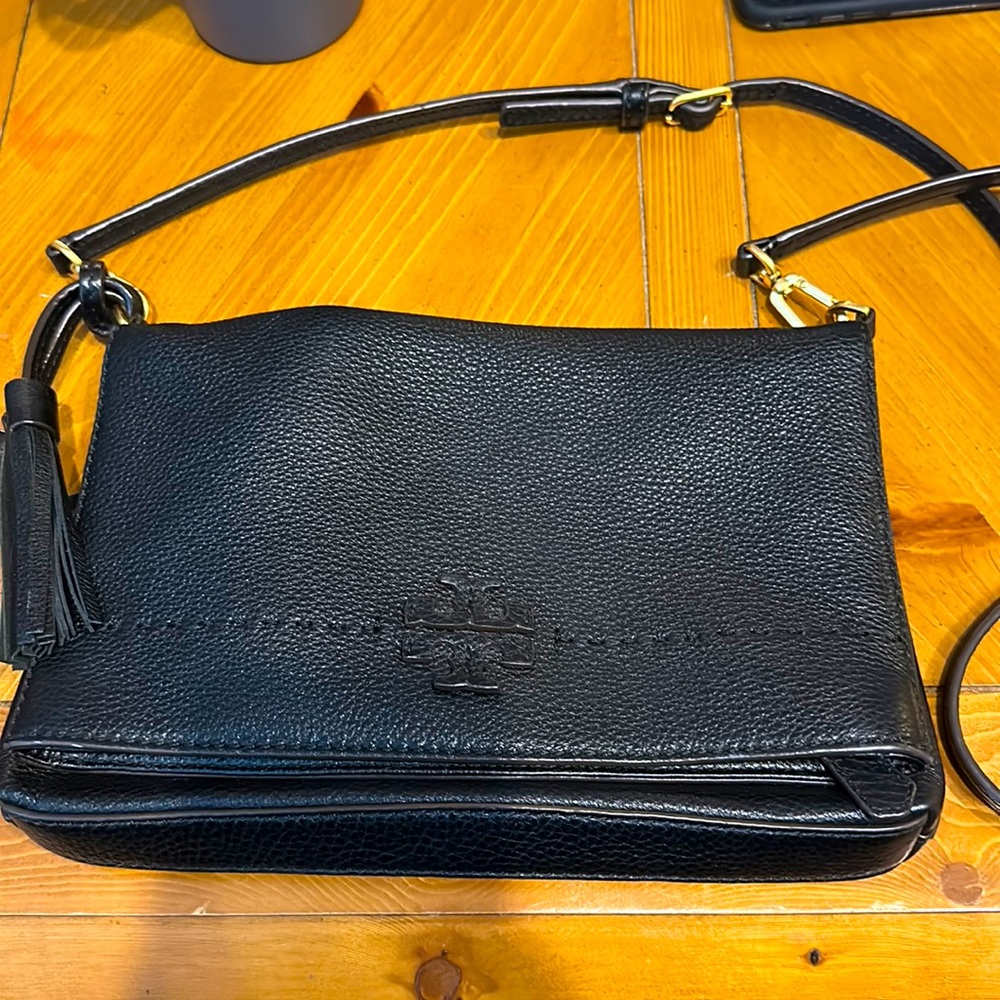 Tory Burch- black leather cross body. Barely used. Excellent condition.